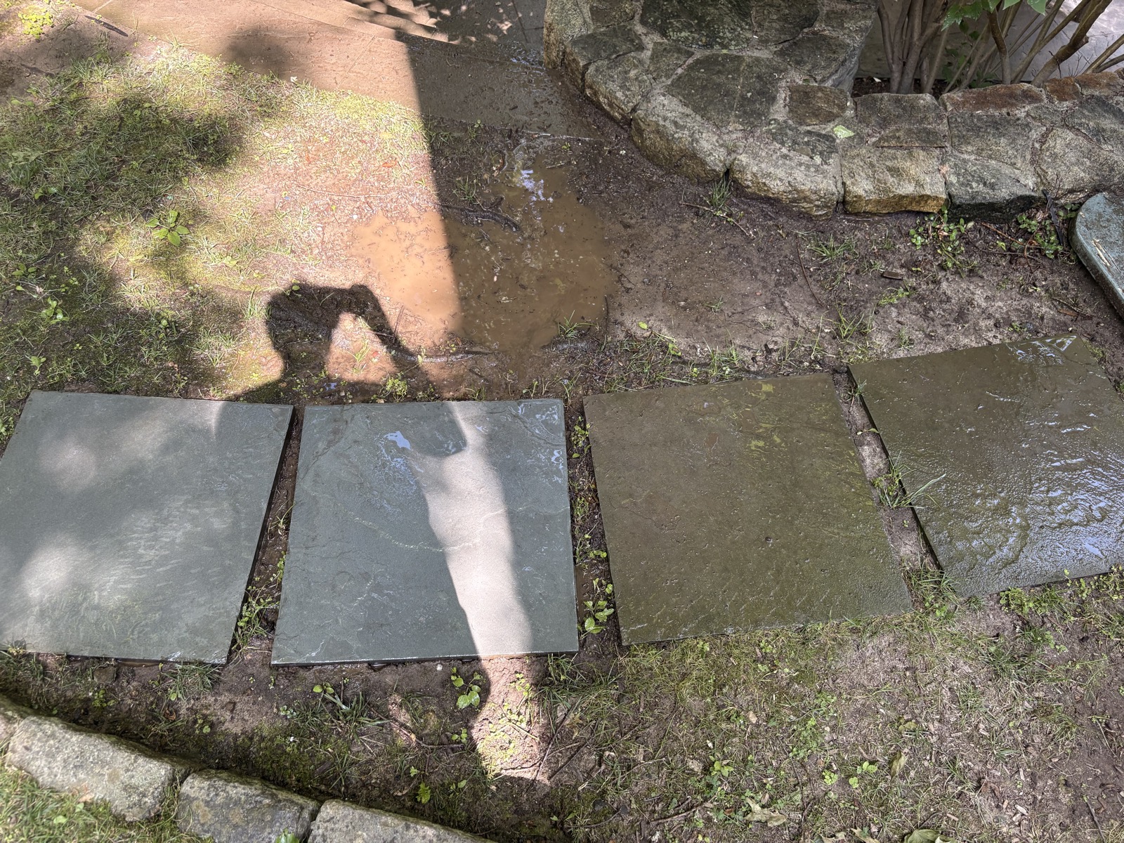 Freshly washed slate walkway stones showing a like-new finish after JLS Solutions service